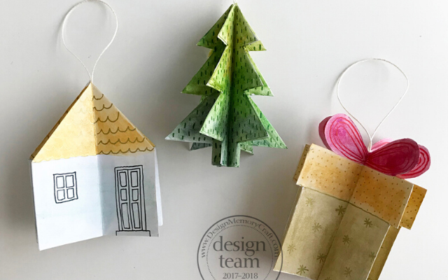 Handmade Christmas ornaments: a house, tree, and Christmas present