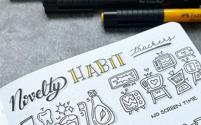 Bullet Journal with habit tracker doodles
